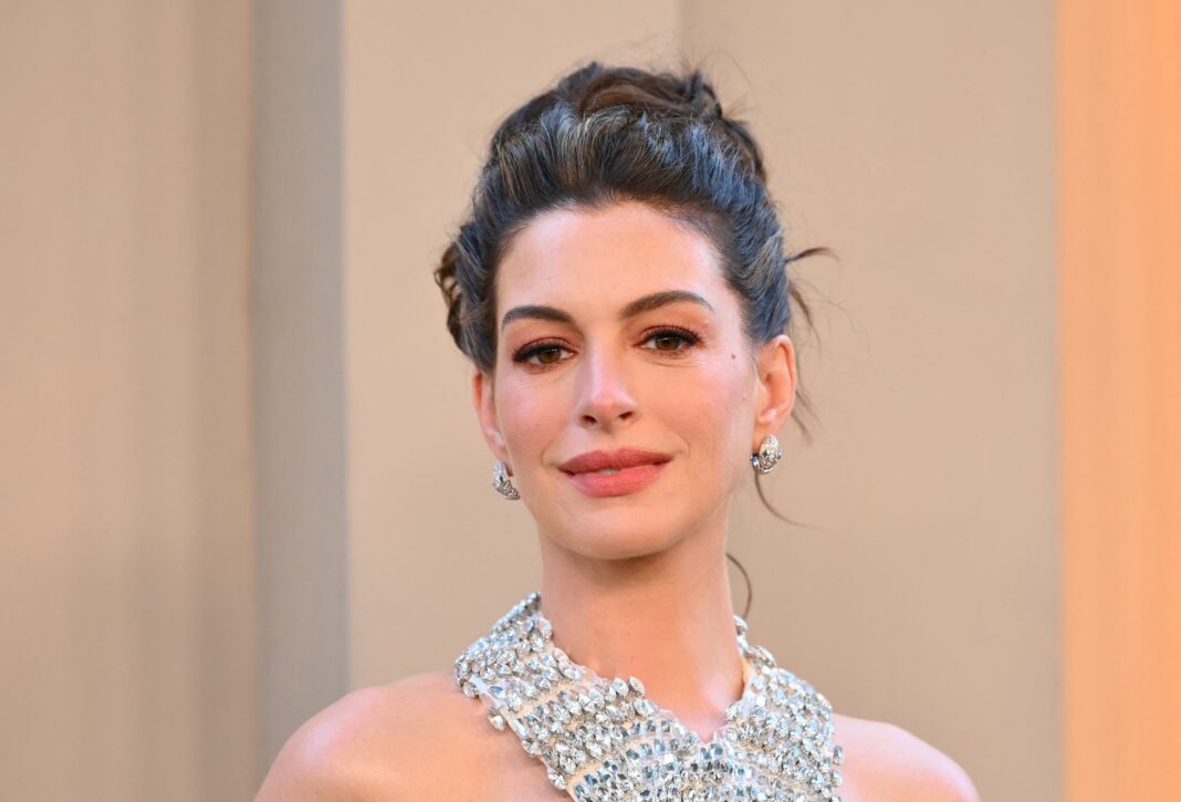 Anne Hathaway’s Bold Red Lips and Nails Prove Matching Manicures Are Fall’s Chicest Beauty Trend